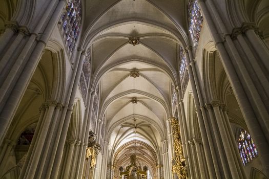 Interior of Toledo Cathedral. Arcs, organ, columns and gothic art. Spain