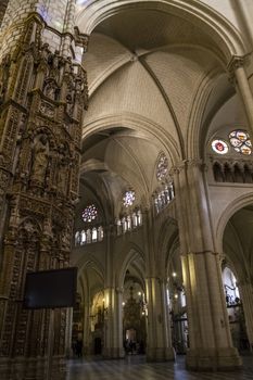 Interior of Toledo Cathedral. Arcs, organ, columns and gothic art. Spain