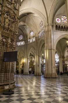 Interior of Toledo Cathedral. Arcs, organ, columns and gothic art. Spain