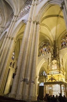 Interior of Toledo Cathedral. Arcs, organ, columns and gothic art. Spain