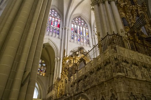 Interior of Toledo Cathedral. Arcs, organ, columns and gothic art. Spain