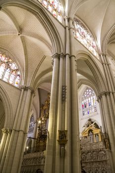 Interior of Toledo Cathedral. Arcs, organ, columns and gothic art. Spain