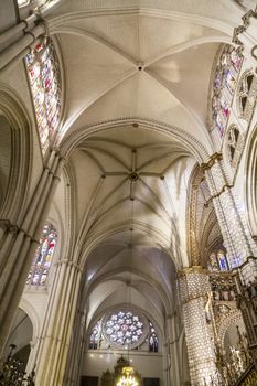 Interior of Toledo Cathedral. Arcs, organ, columns and gothic art. Spain