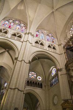 Interior of Toledo Cathedral. Arcs, organ, columns and gothic art. Spain