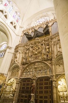 Interior of Toledo Cathedral. Arcs, organ, columns and gothic art. Spain