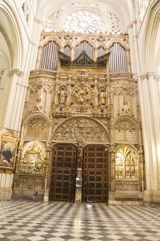 Interior of Toledo Cathedral. Arcs, organ, columns and gothic art. Spain