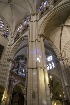 Interior of Toledo Cathedral. Arcs, organ, columns and gothic art. Spain