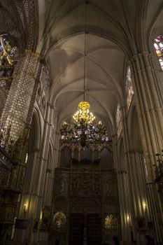 Interior of Toledo Cathedral. Arcs, organ, columns and gothic art. Spain