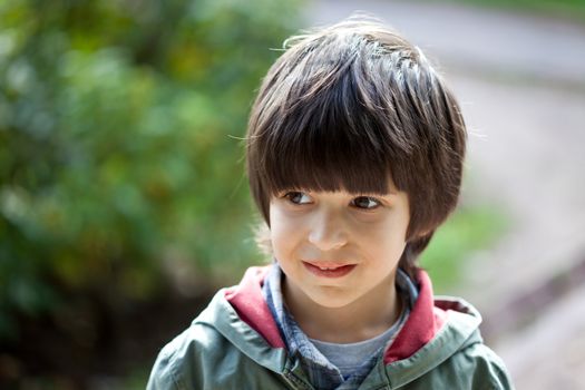 portrait of a young boy on the open air