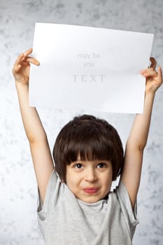 enthusiastic boy overhead showing  displaying placard ready for your text or product