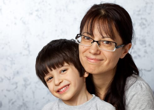 Smiling happy mother and son