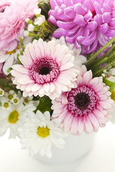 Bouquet of pink and white flowers arranged in small vase