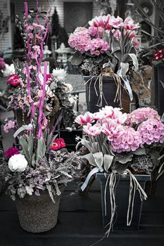 Several pink spring floral arrangements for sale at the florist