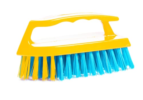 isolated  kitchen scrubbrush with yellow handle