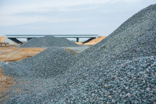 view road works trough  pile of gravel