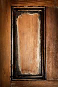 Panel in antique wooden door as vintage frame or rustic background