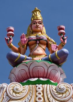 Goddess Lakshmi on top of the entrance gate at Sripuram, the Golden Temple, in Vellore, Tamil Nadu, India.