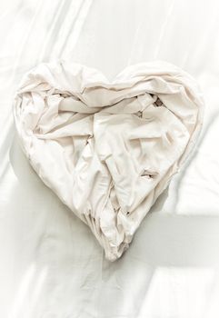 Photo of bed sheet in shape of heart