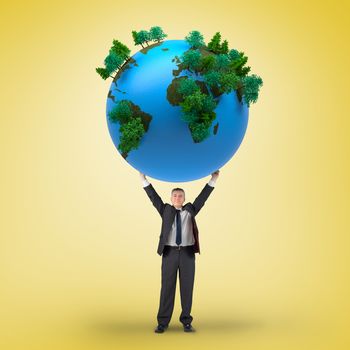 Composite image of businessman holding earth against yellow vignette