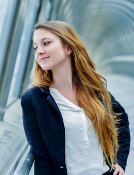 Outdoor portrait of a pretty dynamic junior executive