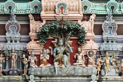 Dhakshinamoorthy statue on the gopuram of Rathinagiri Hill Temple in Vellore, Tamil Nadu, India. Dhakshinamoorthy is an avatar of Shiva when he changed the name of his future wife Parvati.