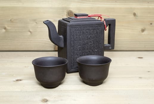 chinese or asian teapot on wooden background