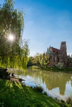 STUTTGART, GERMANY - APRIL 24, 2014: People are enjoying a great sunny spring day around Johanneskirche (St. Johns Church) at Feuersee (fire pond) on April, 24,2014 in Stuttgart, Germany.