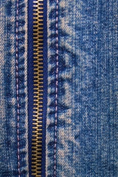 metal zipper with denim. close up. macro