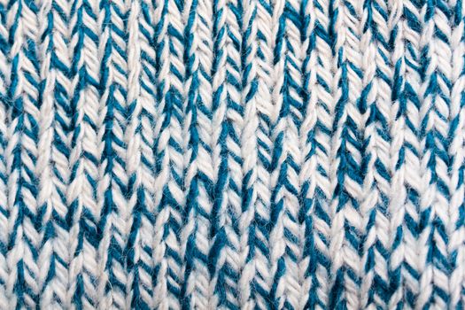 product of knitted white and blue woolen threads. macro