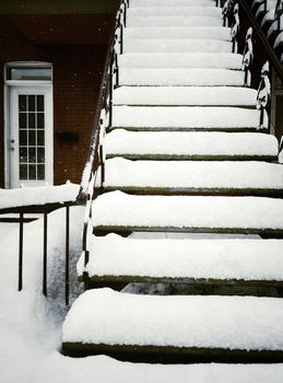 Staircase covered by snow, after snowstorm in Montreal, Canada.