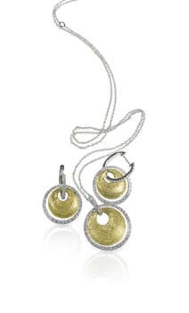 Diamond white and yellow gold fashion necklace and earring set isolated on white with a reflection