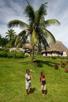 Young boys walking around Navala village, Viti Levu island, Fiji