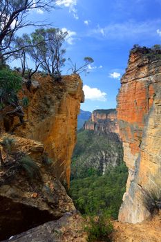 The magnificent sandstone vertical cliffs at Hanging Rock and Burramoko Head, Blue Mountains, NSW Australia.  Please note, this is NOT the Hanging Rock in Victoria.