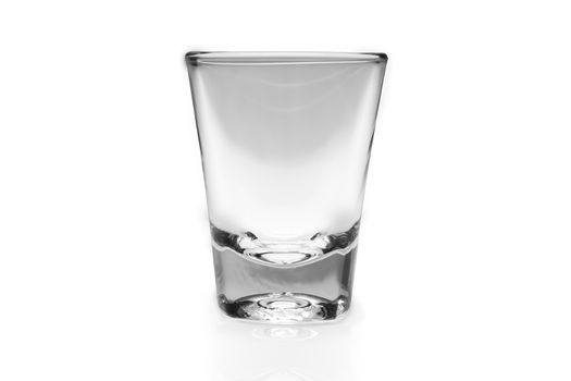 Empty shot glass on white background