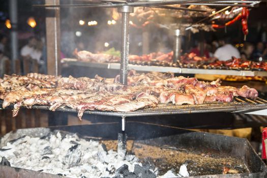 batch of meat in medieval barbecue, Spain