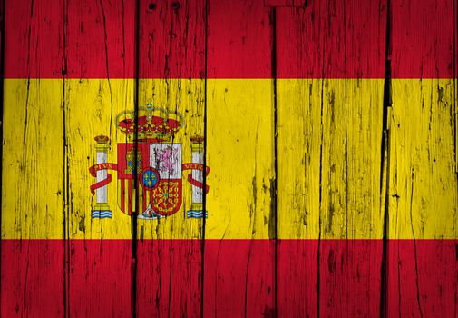 Spain grunge wood background with Spanish flag painted on aged wooden wall.