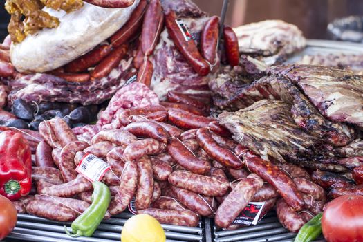 meal, barbecue with sausages and lamb in a medieval fair, Spain