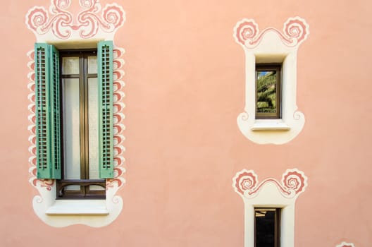 Stylish shaped windows in the walls pink.