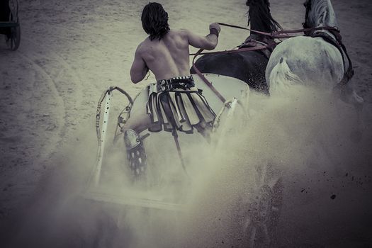 gladiators fighting in the arena, horses and chariots in the Roman circus fight