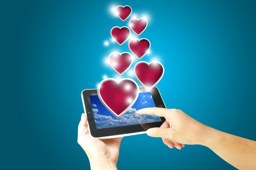 Female Hand hold digital tablet present Heart. Valentine's day concept