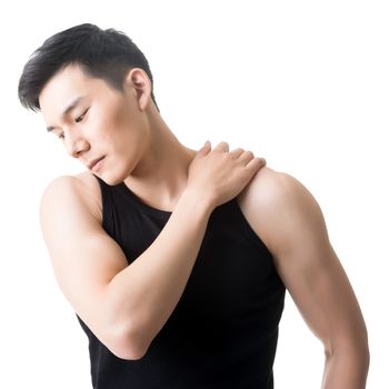 Asian young man having shoulder pain, closeup portrait on white.