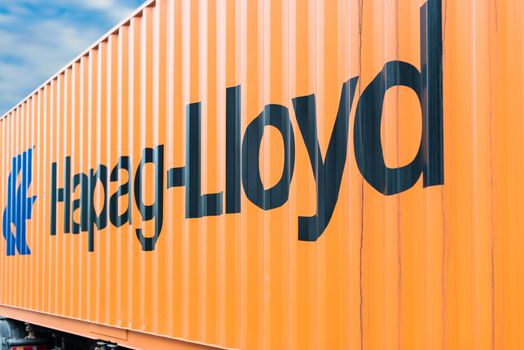 OSTFILDERN-SCHARNHAUSEN, GERMANY - MAY 1, 2014: A Hapag Lloyd container is waiting on a trailer to continue its travel after the public holiday (May Day) on May, 1,2014 in Ostfildern-Scharnhausen near Stuttgart, Germany.