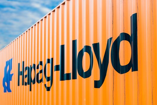 OSTFILDERN-SCHARNHAUSEN, GERMANY - MAY 1, 2014: A Hapag Lloyd container is waiting on a trailer to continue its travel after the public holiday (May Day) on May, 1,2014 in Ostfildern-Scharnhausen near Stuttgart, Germany.