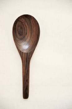 Wooden spoon on fabric in vintage style