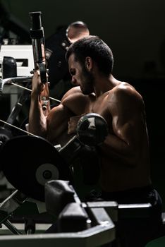 Young Man Working Out Biceps