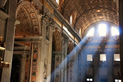 Interior of Saint Peters Basilica with crepuscular rays, Vatican City, Rome