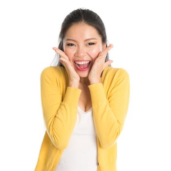 Young Asian girl surprises and shouts out, face expression, isolated on white background.