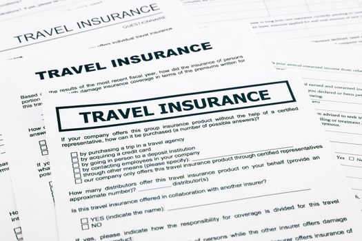 travel insurance form, paperwork and questionnaire for insurance concepts