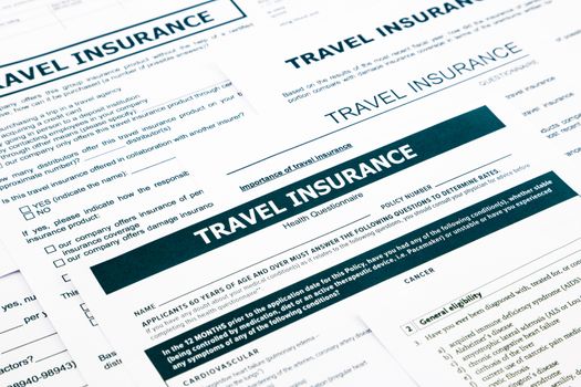 travel insurance form, paperwork and questionnaire for insurance concepts