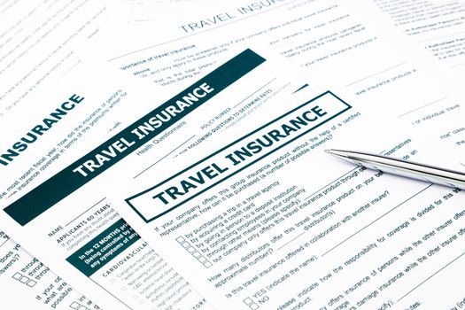 travel insurance form, paperwork and questionnaire for insurance concepts